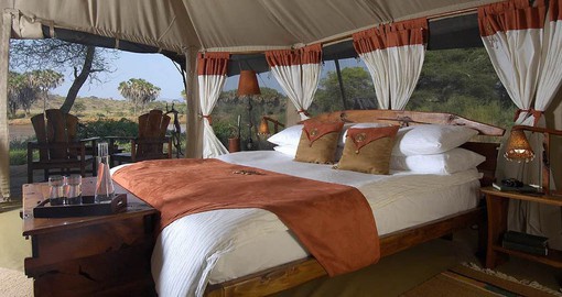 Elephant Bedroom Camp's spacious tents have rustic and colourful African touches
