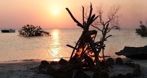 A campfire on the tropical beach of Bazaruto Island is a great romantic getaway on your Mozambique vacation