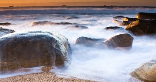 Milky waves and rocky shore beach of Umhlanga near Durban