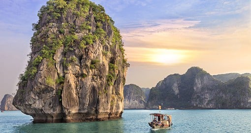 Cruise along the calming waters and unique rock formations of Halong Bay