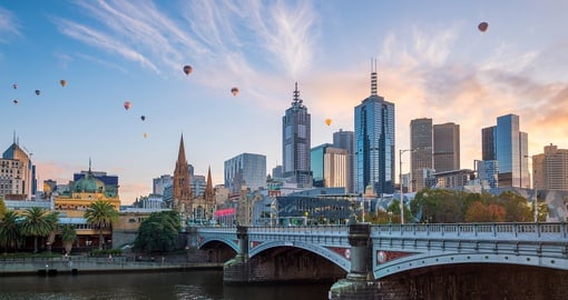 Melbourne skyline at twilight along river