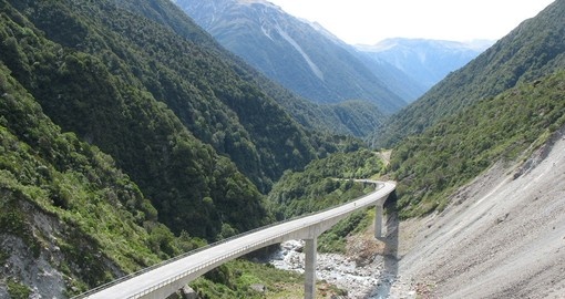 Begin this tour with the TranzAlpine train ride through Arthurs pass during your New Zealand Vacation.