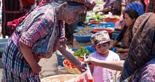 Buy vegetables at a traditional market
