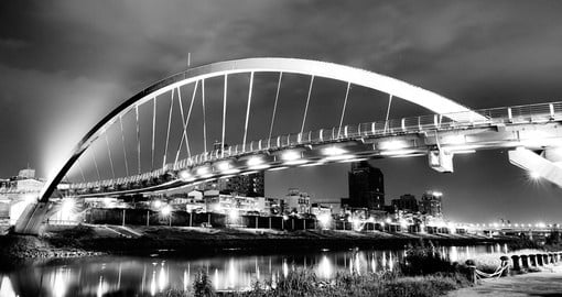 Night lights and a beautiful steel arch bridge