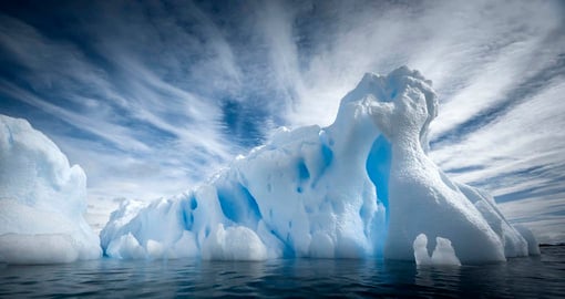 Explore the Antarctic by ship where you will have the experience of seeing surreal ice bergs that dot the peninsula on your Antarctica Trip