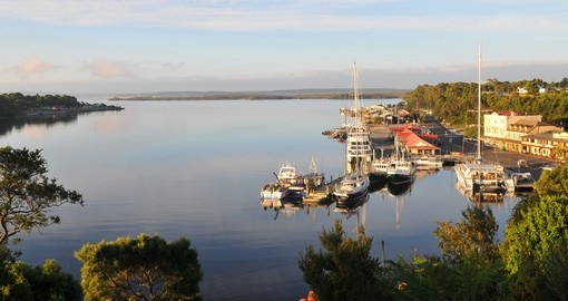 Experience the view of Strahan Village in Tasmania on your next Australia tours.