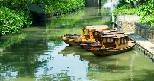 Travelling by boat on the canals of Suzhou is a popular inclusion for China tours.