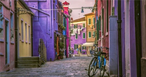 Escape the busy streets of Venice to tour the Pastel Buildings of Burano Island in the Venetian Lagoon