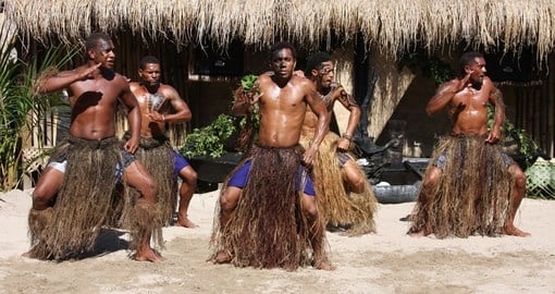 A group performs an island dance