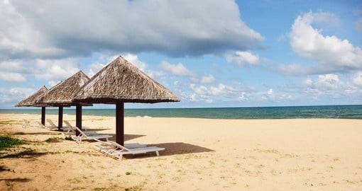 Hut, umbrella and deck chairs on the sandy beaches of Phu Quoc