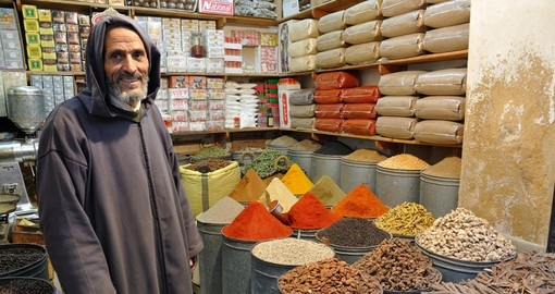 A spice seller in the medina of Fez makes for a great photo opportunity on all Morocco vacations.