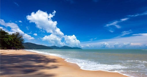 Relax and soak up the sun on the clear water beaches of Penang Island on your Trip to Malaysia