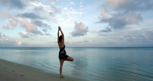 Sunrise yoga and the sea coast