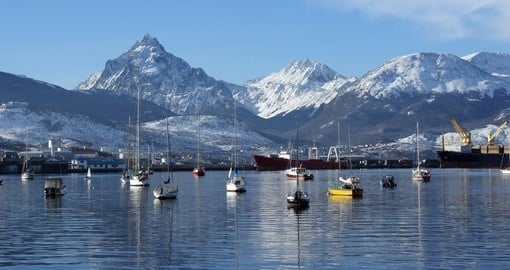 Explore the vibrant town of Ushuaia with a scenic mountain view as a backdrop on your Antarctica Travel
