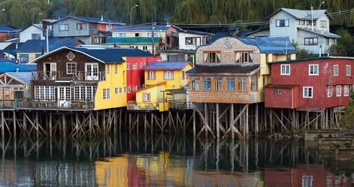 Enjoy views of traditional houses on Chiloe Island on your Chile Tour