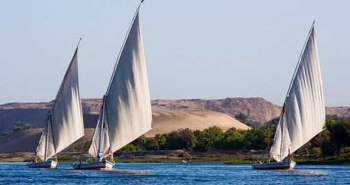 Feluccas sailing on the Nile are a great photo opportunity while on Aswan tours.