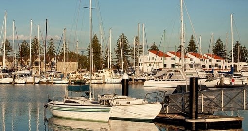 Evening sunshine on a yacht marina in Adelaide during your next trip to Australia.