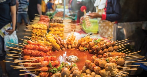 Enjoy traditional snacks on your Thailand tour