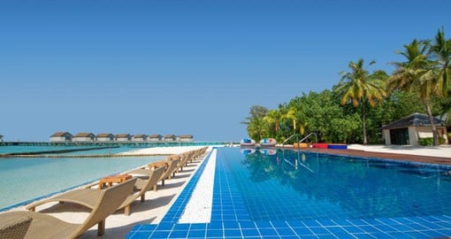 Enjoy a relaxing swim while taking in the gorgeous beach view just meters away