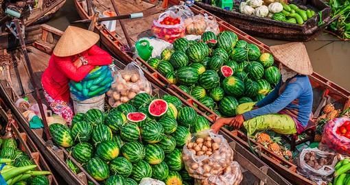 Visit the Cai Be Floating Market on the Mekong Delta