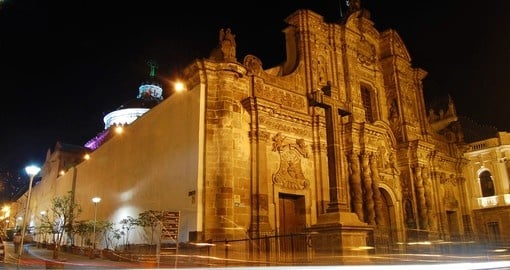 Beautiful La Compania Church at night in downtown Quito on your next trip to Ecuador.