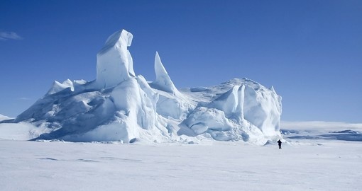 Iceberg frozen solid in sea ice