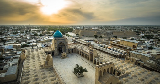 Make a stop along the Silk Road trade at Bukhara, known for bazaars, madrassas, and mosques