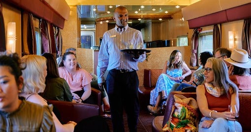 Enjoy at social hub of the train, the perfect setting to get to know fellow travellers, enjoy a snack