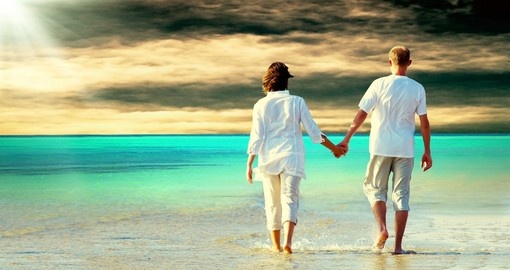 Walking on the beach holding hands