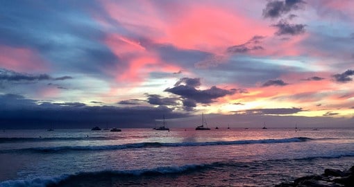 Relax on the calming waters of a sunset cruise to enjoy the colourful skies of Lahaina