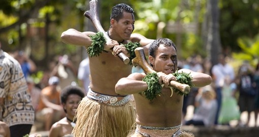 Traditional Fijian dances on a canoe