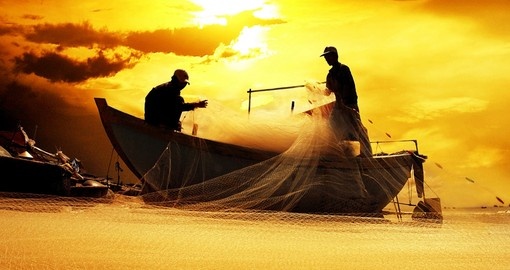 Silhouette of Vietnamese fishermen - a photo opportunity for all Vietnam vacations.