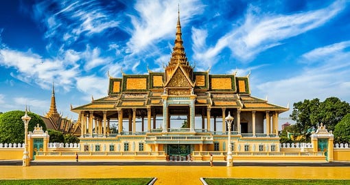 Admire the glistening gold of the Phnom Penh Royal Palace and its unique architecture