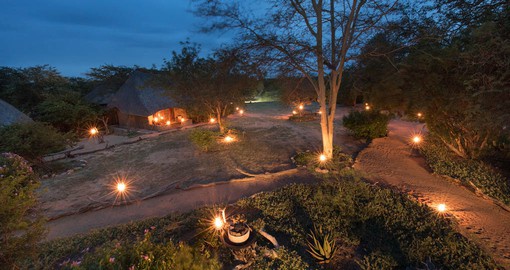 Safari Lodge has 8 elegantly thatched chalets traditionally set around the camp waterhole.