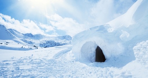 Igloo and snow shelter in high snowdrift