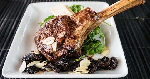 Roasted Australian rack of lamb with almonds and grapes - one of many great meals you will experience on your Australia vacation.