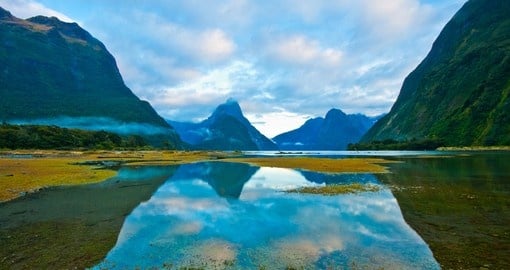 Explore this magical landscape of high mountain glacier at Milford Sound on your next New Zealand tours.