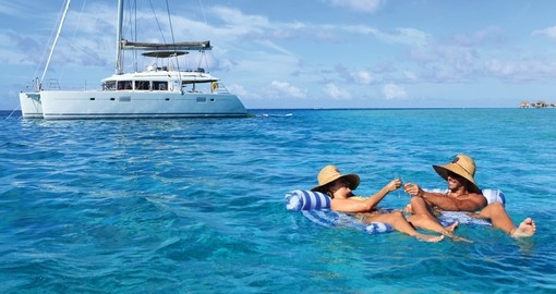 Relax on Floating Hammocks during your next Bora Bora tours.