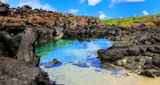 Fall into the blue beauty of water and sky surrounding the volcanic islands of the Galapagos