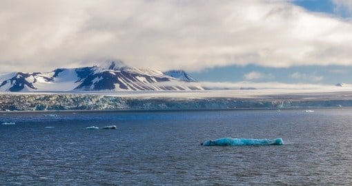 Glacier in the Arctic Circle where it falls into the ocean
