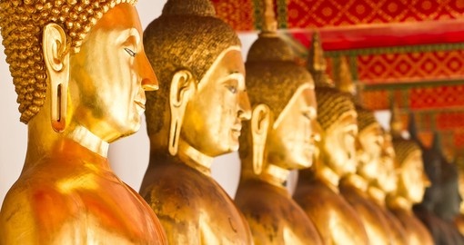 Come face to face with the gold plated Buddha statues that are located in Wat Po on your Thailand Vacation