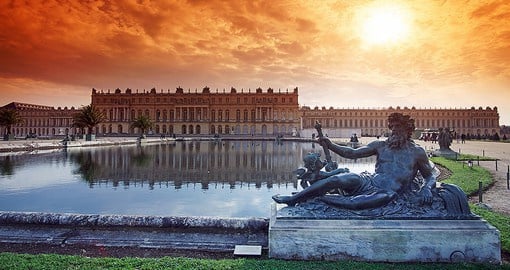 Step outside of Paris to visit royalty at the extravagant Palace of Versailles