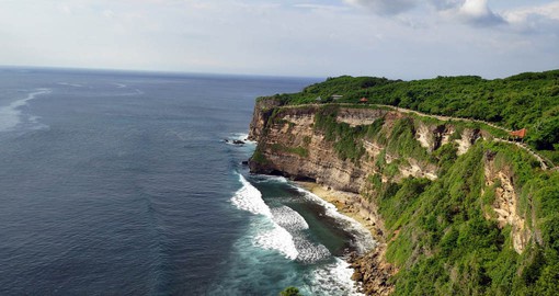 The Uluwatu Temple in Bali is an incredible sight to witness as it overlooks the Indian Ocean