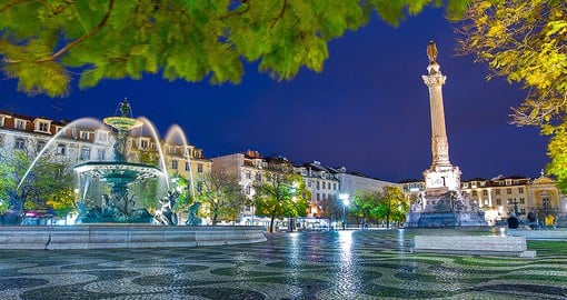 Join the crowd as they gather at Rossio Square, Lisbon's most popular public square surrounded by restaurants, shops, and ocean view