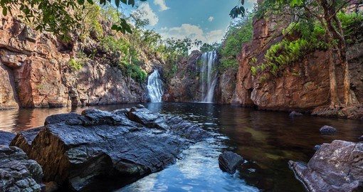 Add up to your memory by visiting stunning waterfalls and crystal clear pools at Litchfield National Park on your next vacations to Australia