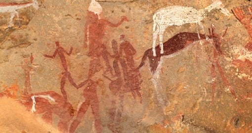 Bushmen rock painting of human figures and antelope