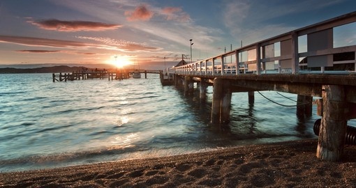Sunset in the beautiful Bay of Islands is a great photo opportunity on all New Zealand tours.