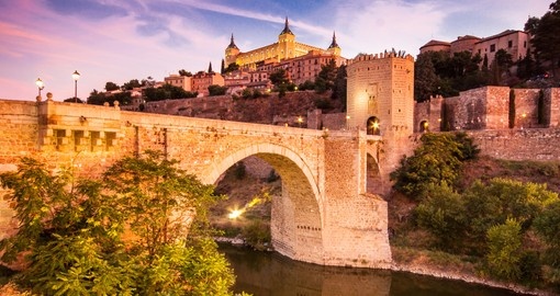Panorama of the Alcazar above the medieval San Martin bridge - Toledo, Spain