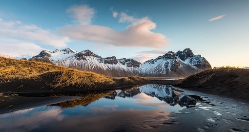 Visit Vesturhorn Mountain and black sand dunes on your next Iceland vacations.