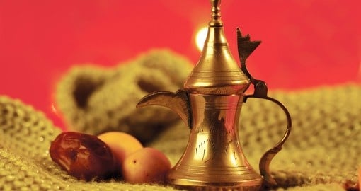 Golden arabic tea pot with dates